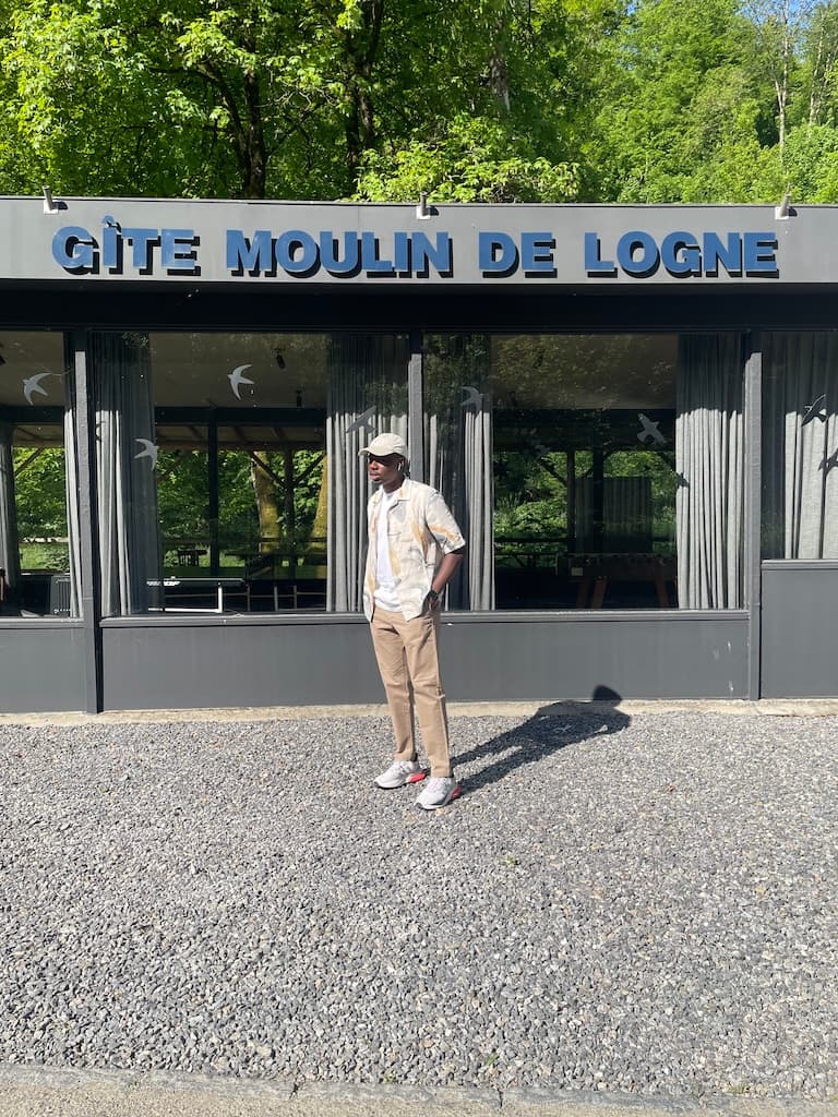 ✌🏾 A photo of myself, standing on a sunny day outside
